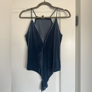 Express blue velvet bodysuit with plunging neckline